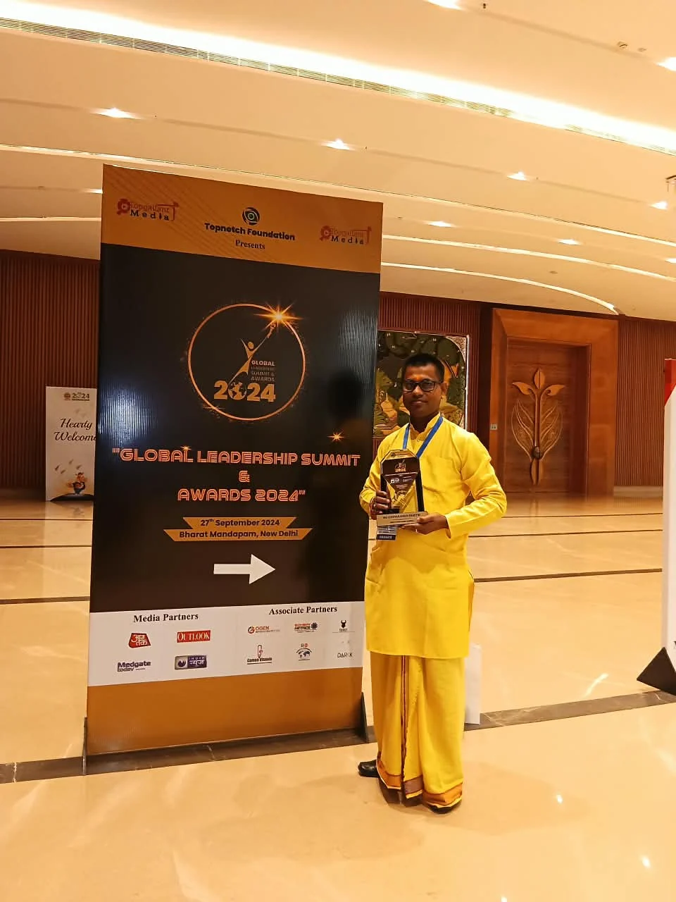 Chittaranjan Shastri in a yellow kurta and dhoti at a public event